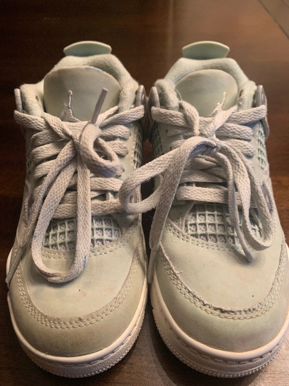 Kids seafoam green Jordan 4s